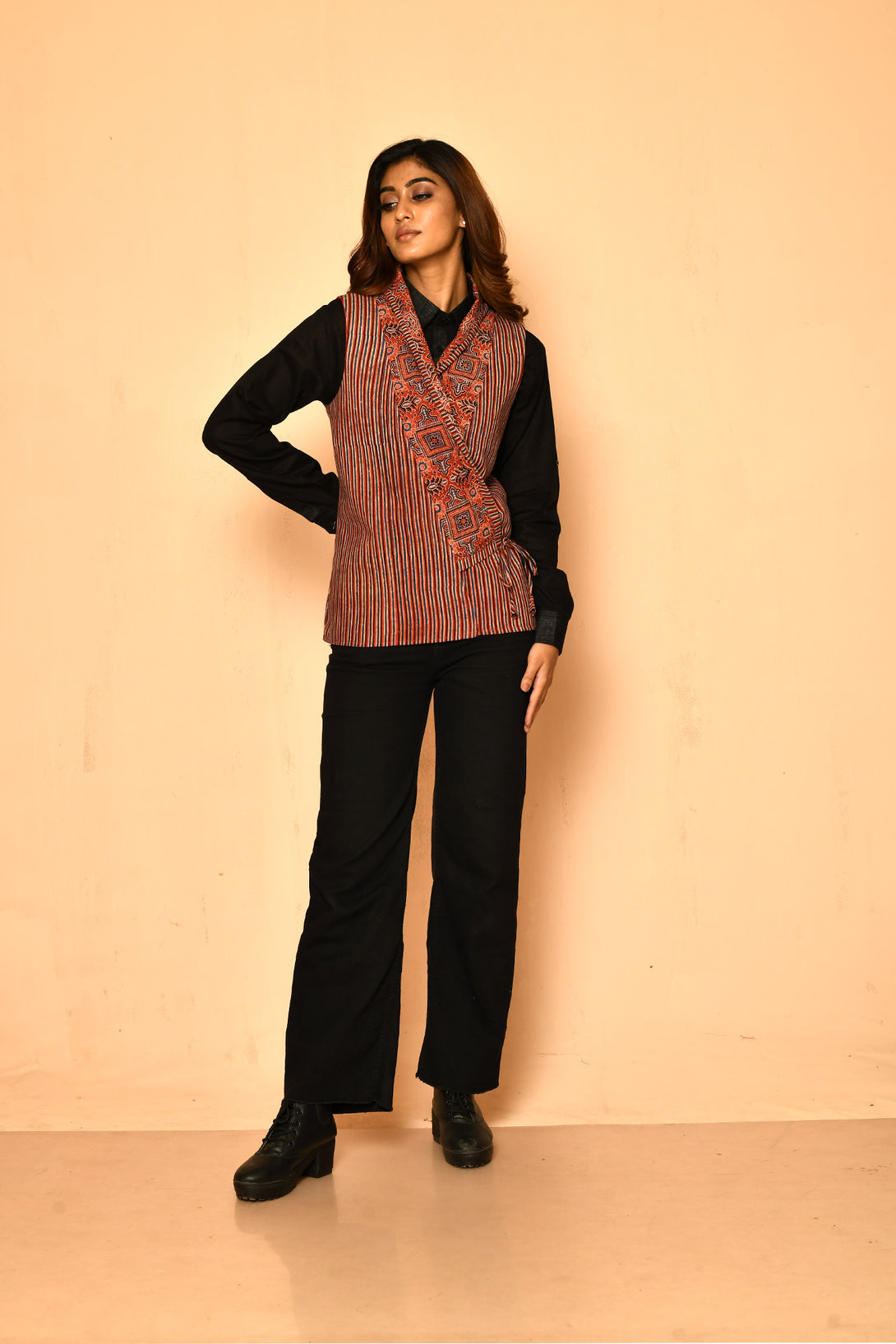 Add fun to your work wear with this red ajrakh waist length jacket for women